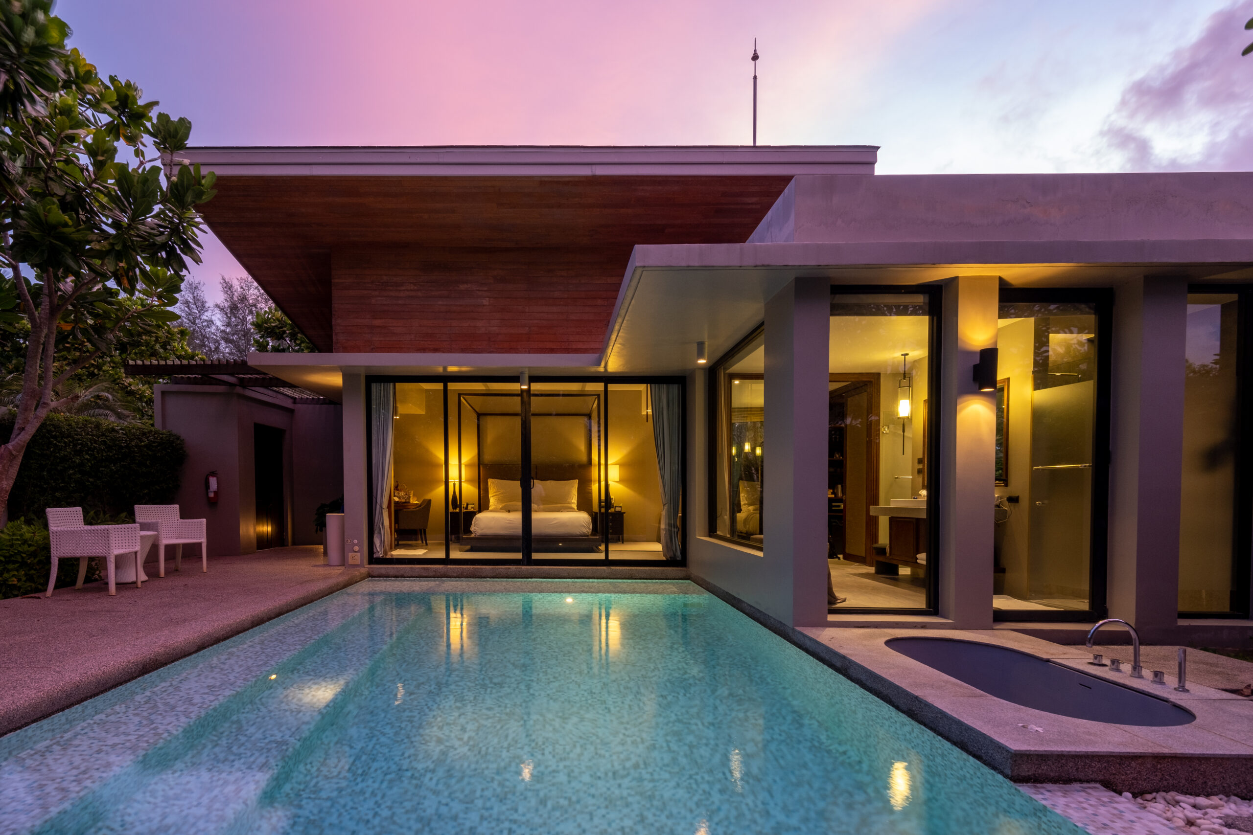 Outside of modern house with a swimming pool, modern pool villa at the beach